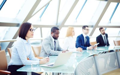 Business people sitting attentively at meeting